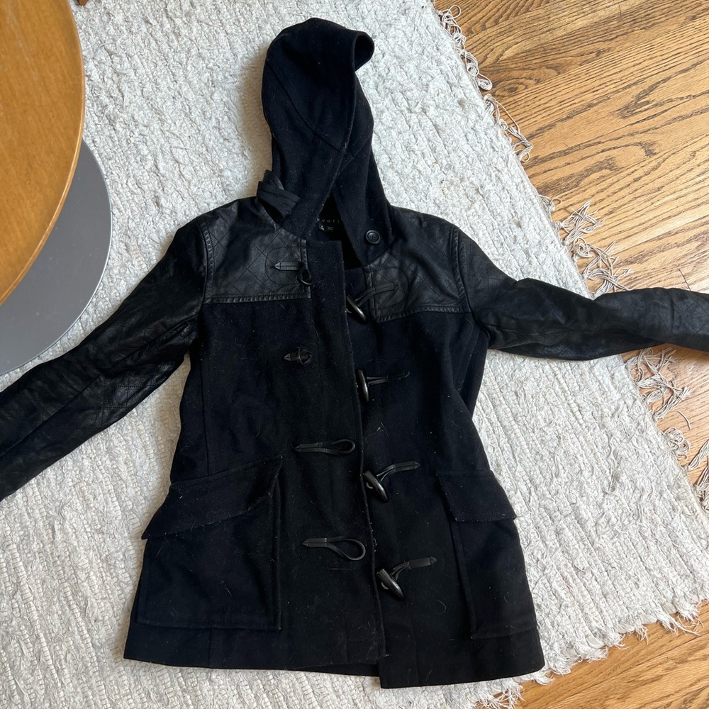 THEORY: Wool pea coat with leather sleeves and a hood.